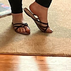 They are brown flip flops with black lace top